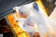 A woman in a white wedding dress posing for a picture.